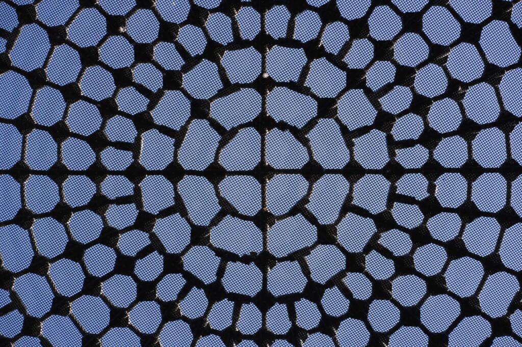 Unique geometric structure in abstract architectural roof ceiling design with sky view.